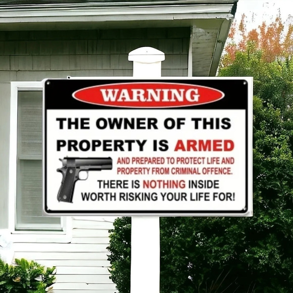 Other - warning the owner is this property is armed metal sign